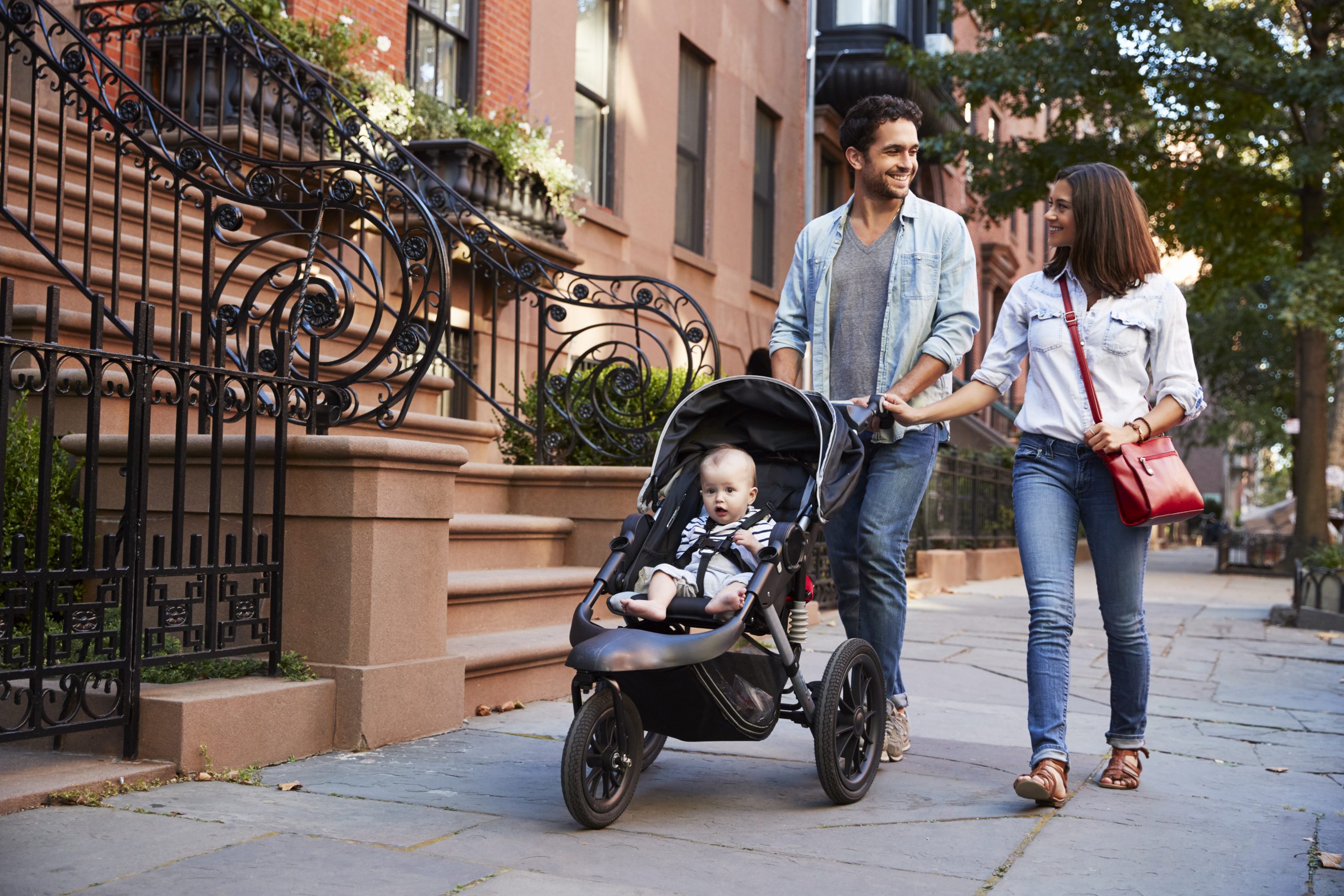 Family taking a walk down the street, close up